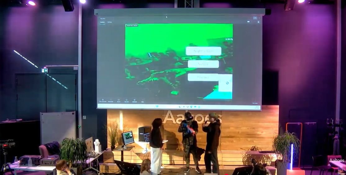 Presenting the working demo on stage at Aaltoes